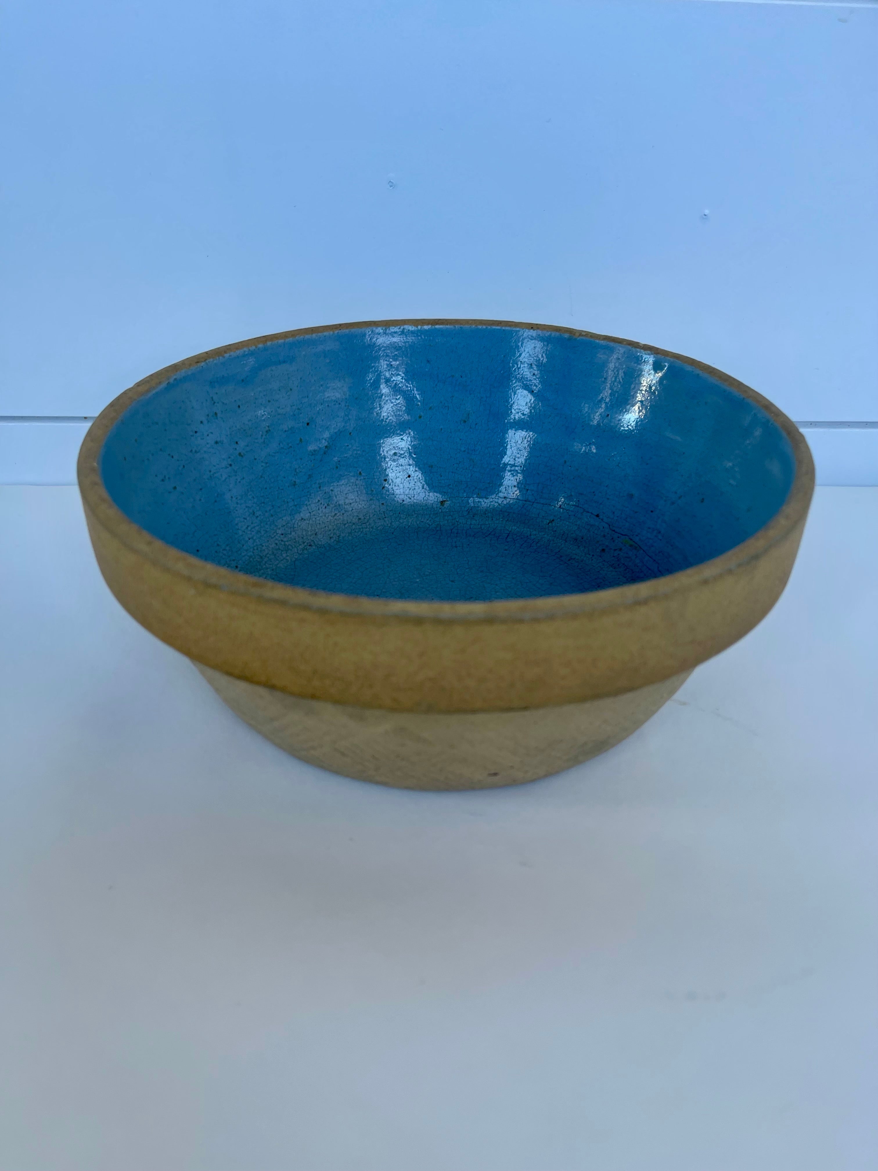 Vintage stoneware bowl with beautiful blue glazed interior